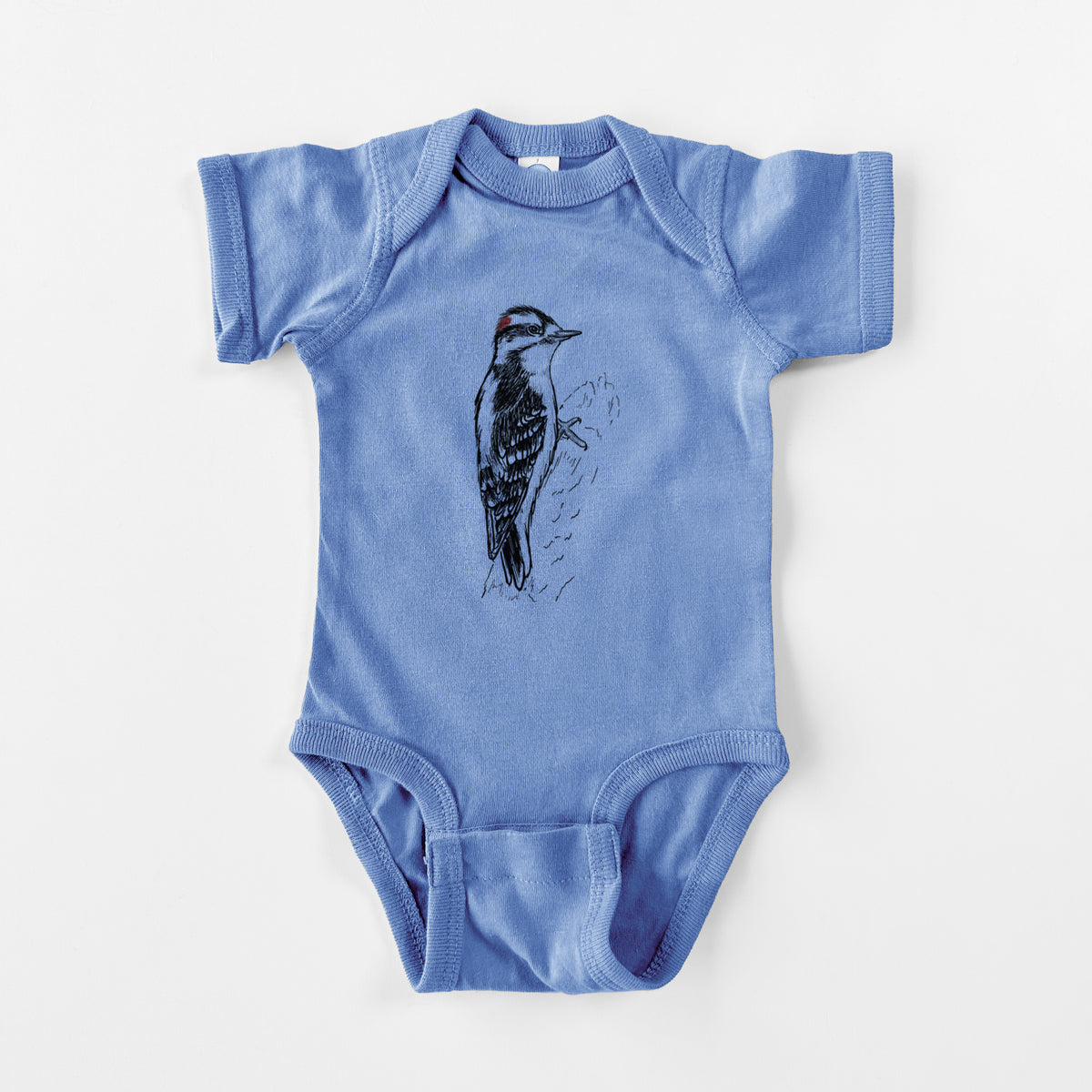 Carolina blue baby bodysuit laid flat, printed with a detailed black ink illustration of a downy woodpecker clinging to a tree trunk.