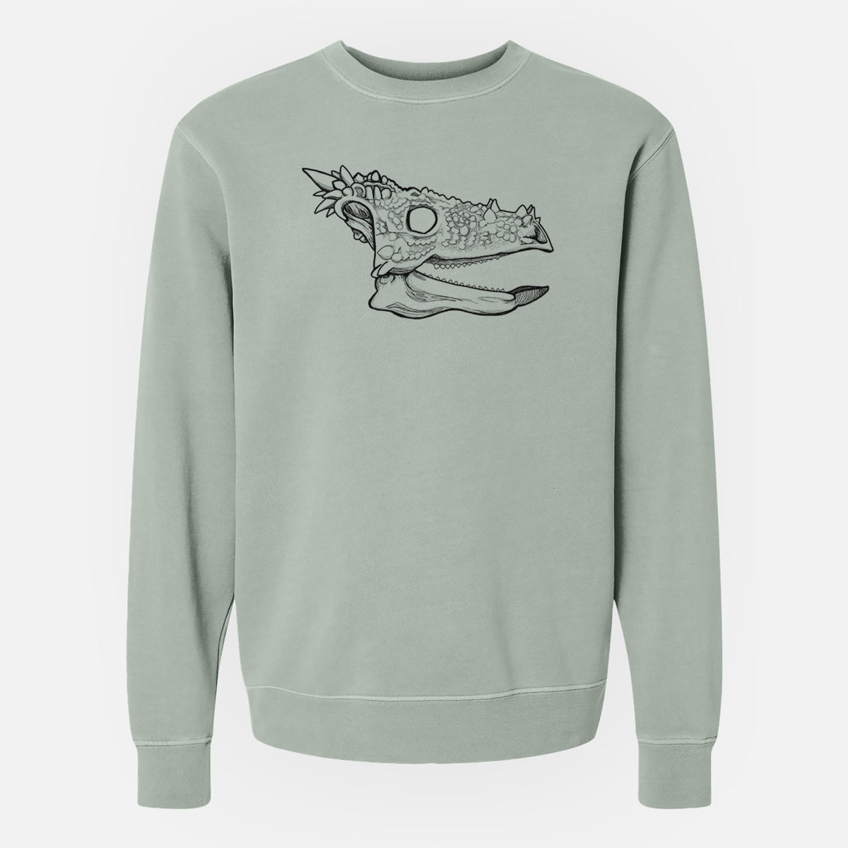 Sage green pigment dyed crewneck sweatshirt laid flat, printed with a black ink illustration of a spiky Dracorex dinosaur skull.