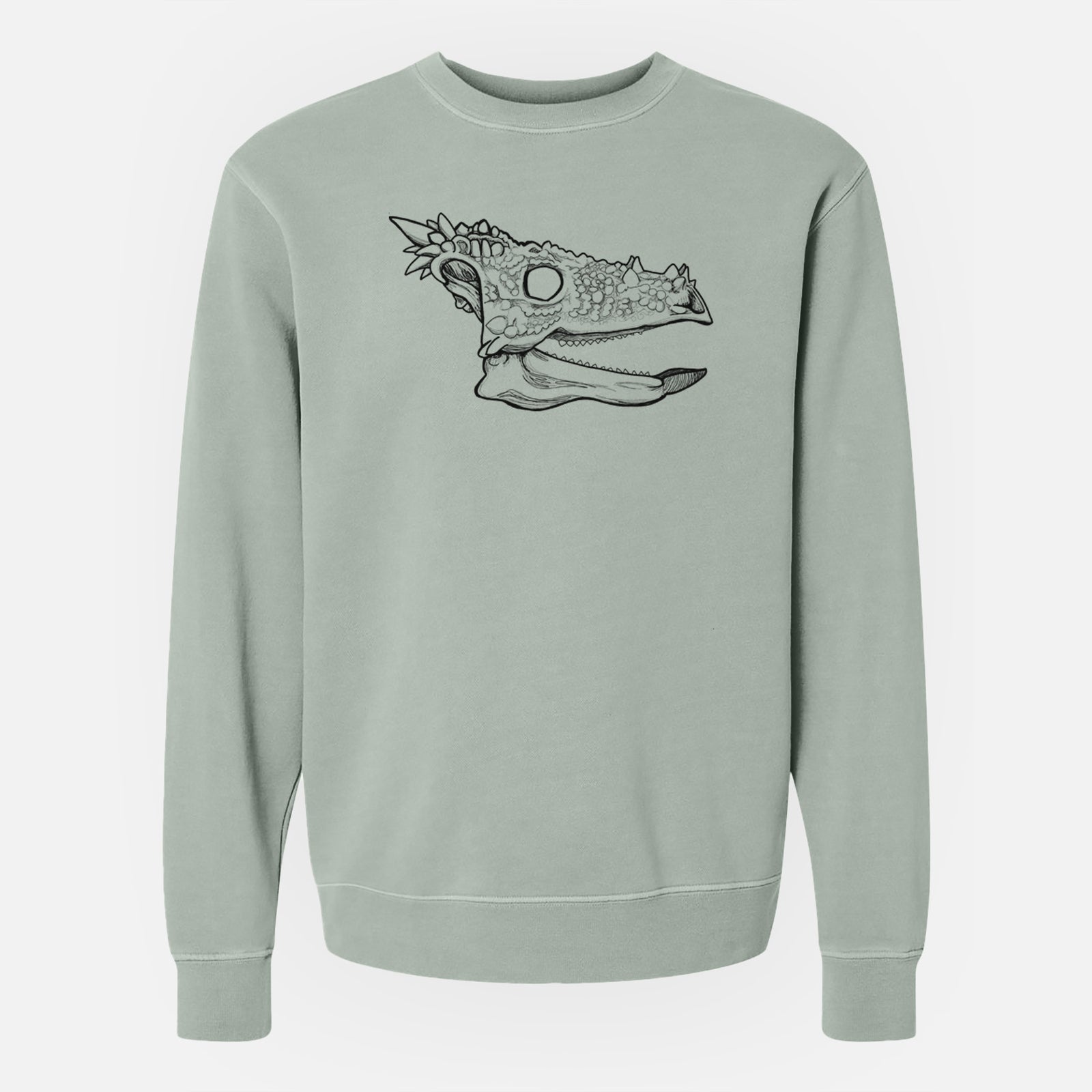 Sage green pigment dyed crewneck sweatshirt laid flat, printed with a black ink illustration of a spiky Dracorex dinosaur skull.