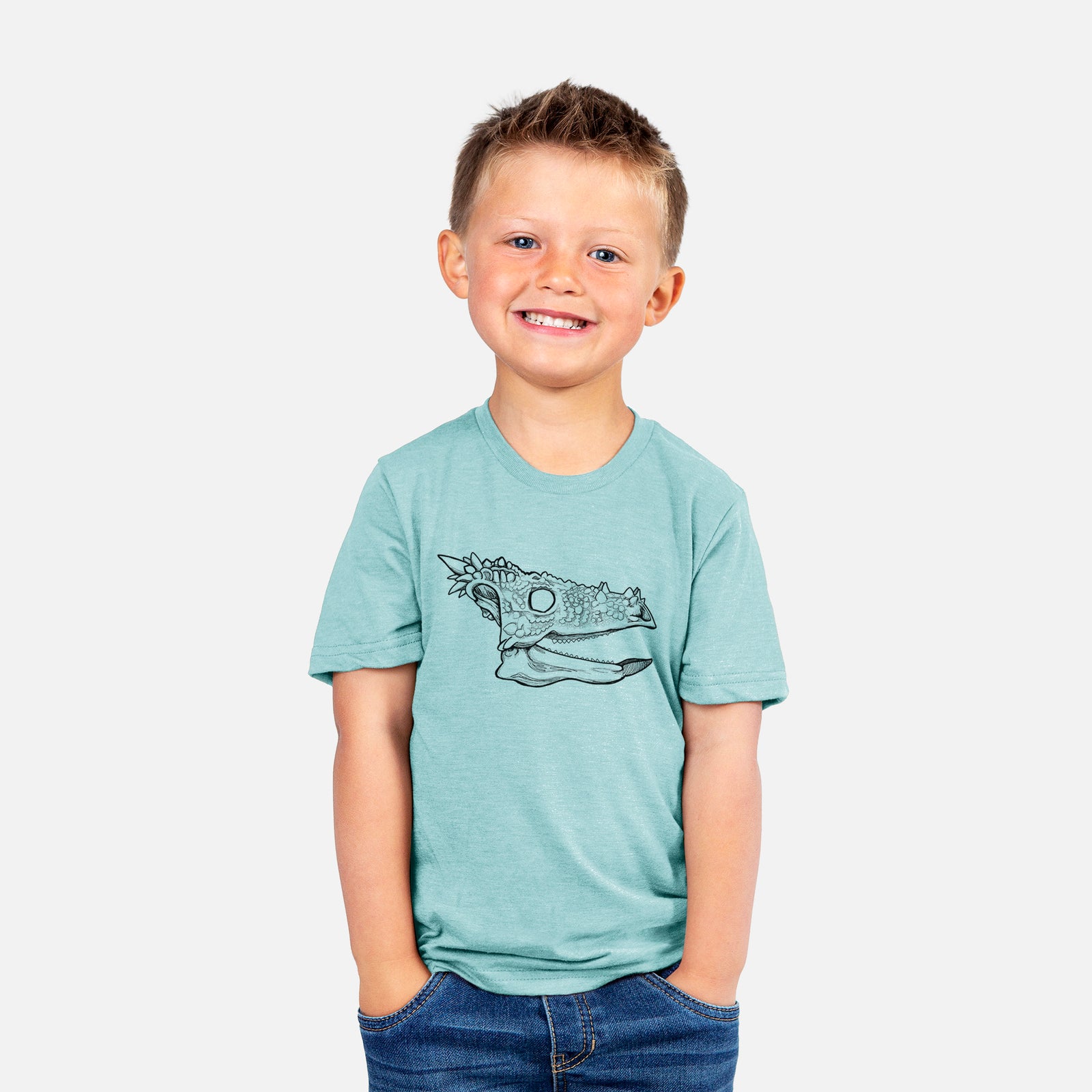 Two youth t-shirts in different colors on hangers, printed with a black ink illustration of a spiky Dracorex dinosaur skull.