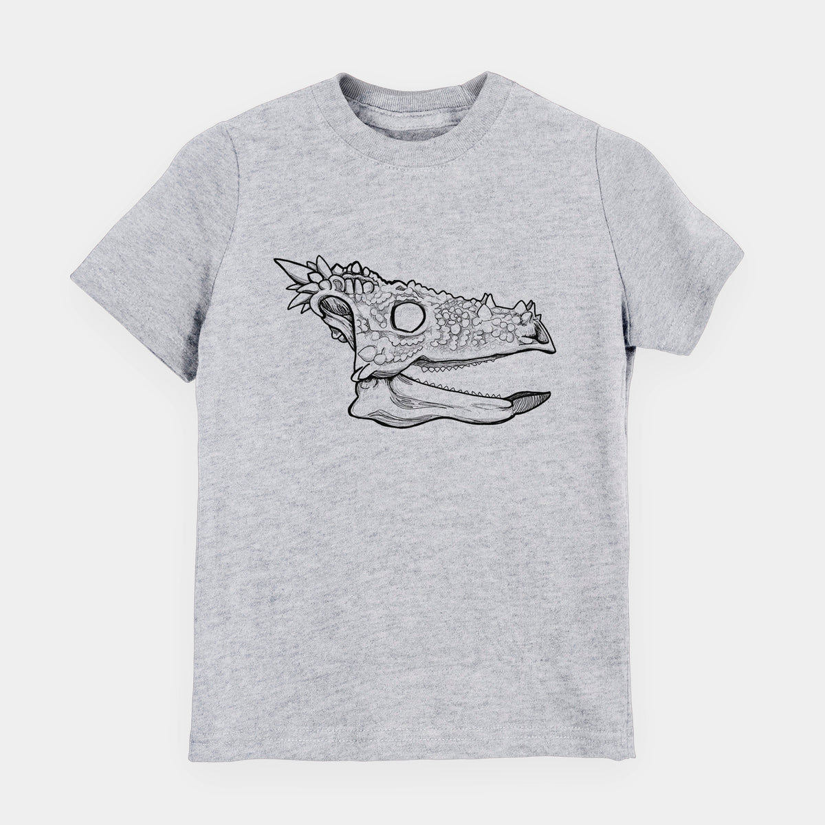 Heather grey youth t-shirt laid flat, printed with a black ink illustration of a spiky Dracorex dinosaur skull.