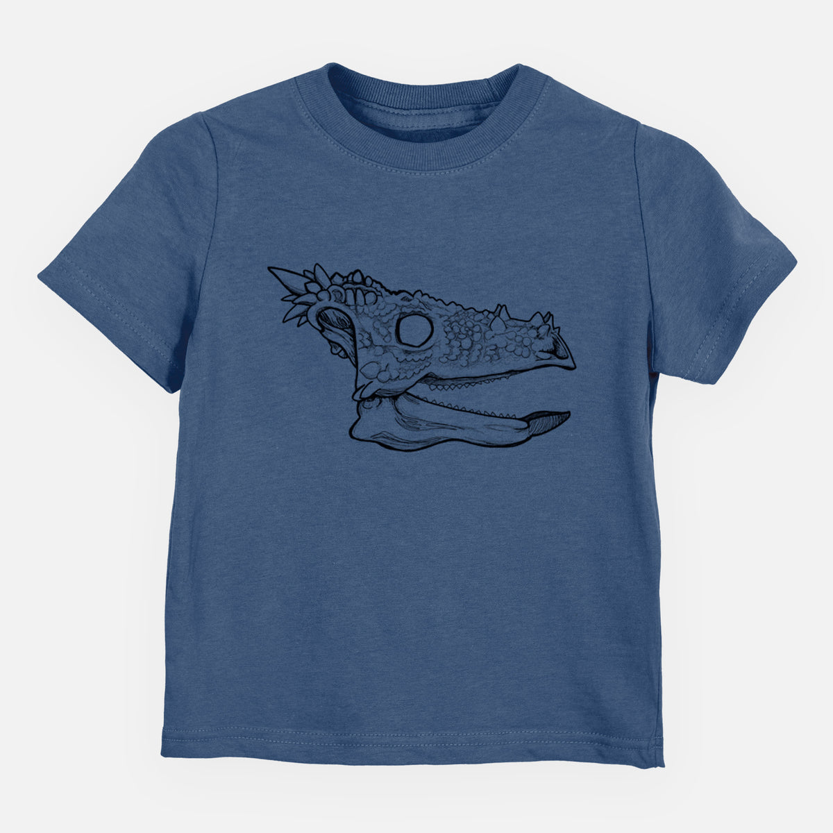 Indigo blue toddler t-shirt laid flat, printed with a black ink illustration of a spiky Dracorex dinosaur skull.