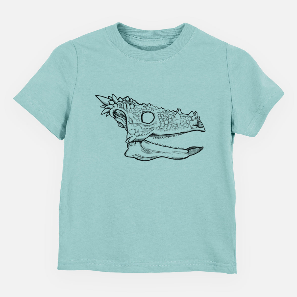 Saltwater toddler t-shirt laid flat, printed with a black ink illustration of a spiky Dracorex dinosaur skull.