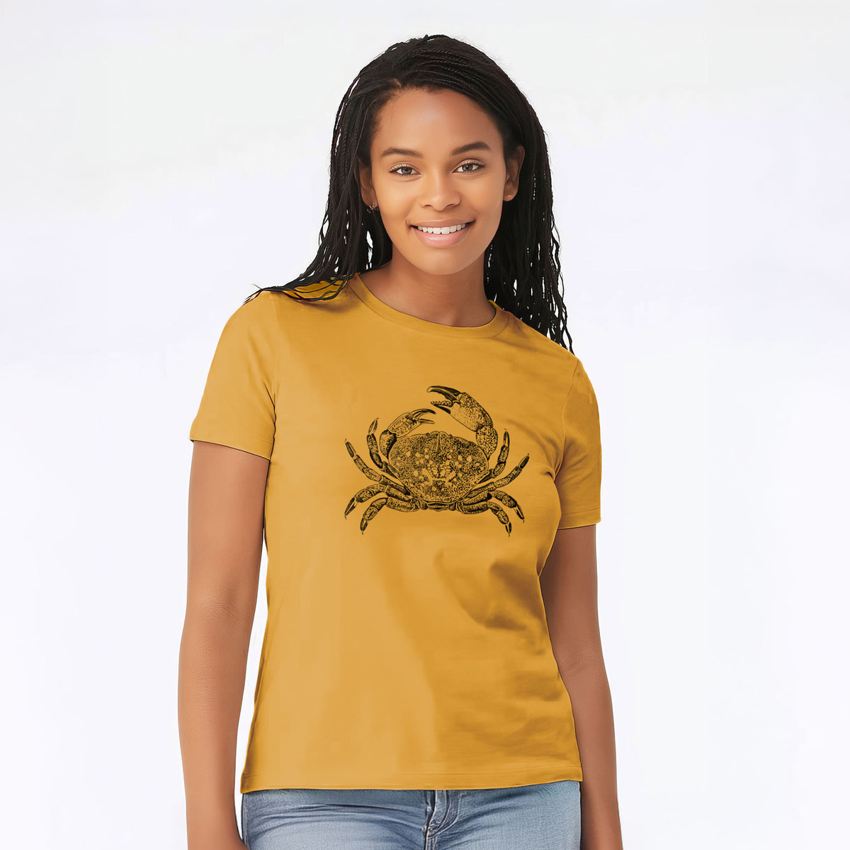 Woman wearing a mustard yellow women's relaxed fit cotton t-shirt printed with a detailed black ink illustration of a Dungeness crab with claws raised, seen from above.