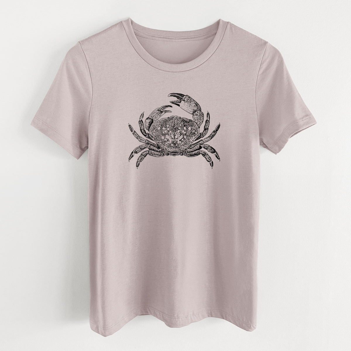 Pink gravel women's relaxed fit cotton t-shirt laid flat, printed with a detailed black ink illustration of a Dungeness crab with claws raised, seen from above.