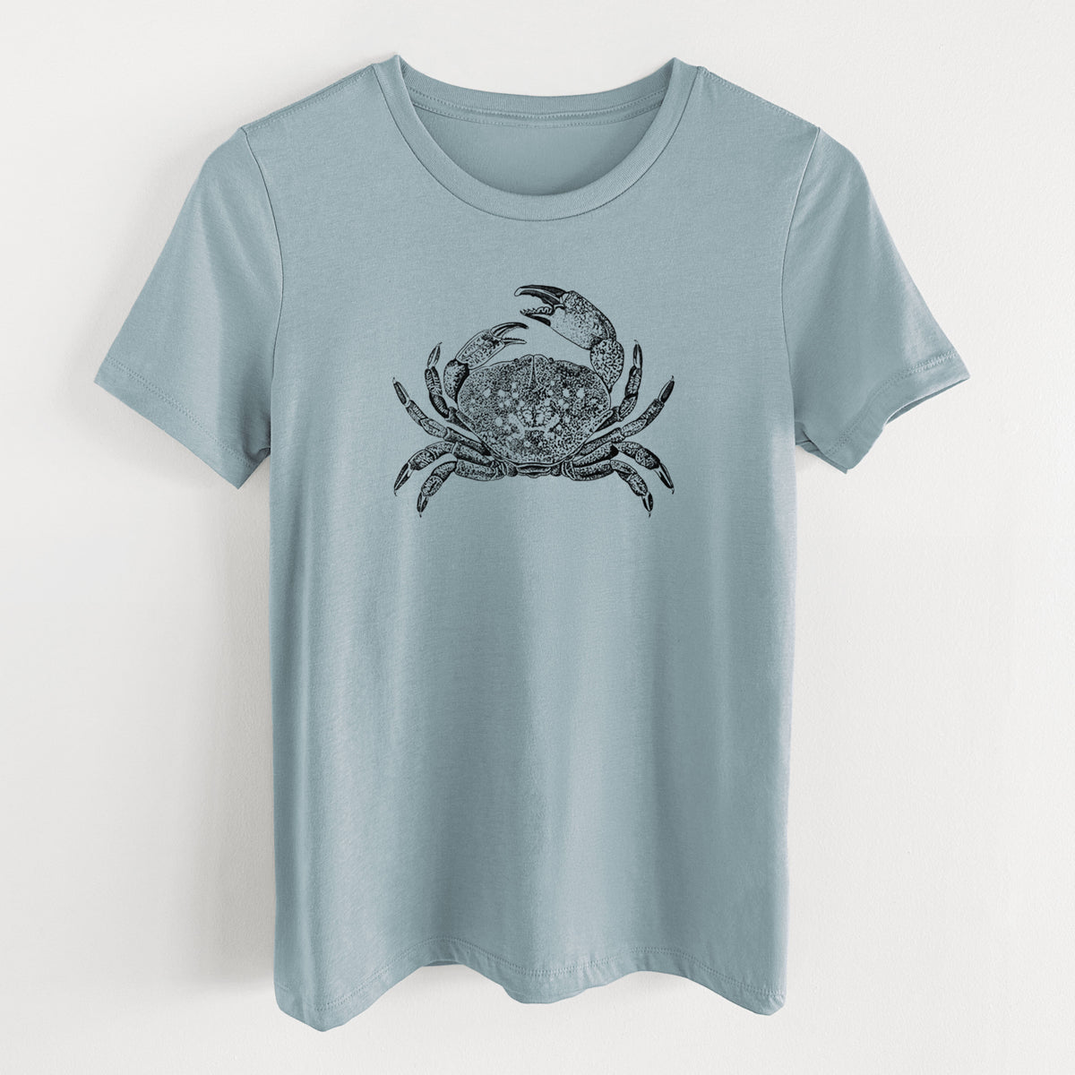 Vintage denim women's relaxed fit cotton t-shirt laid flat, printed with a detailed black ink illustration of a Dungeness crab with claws raised, seen from above.