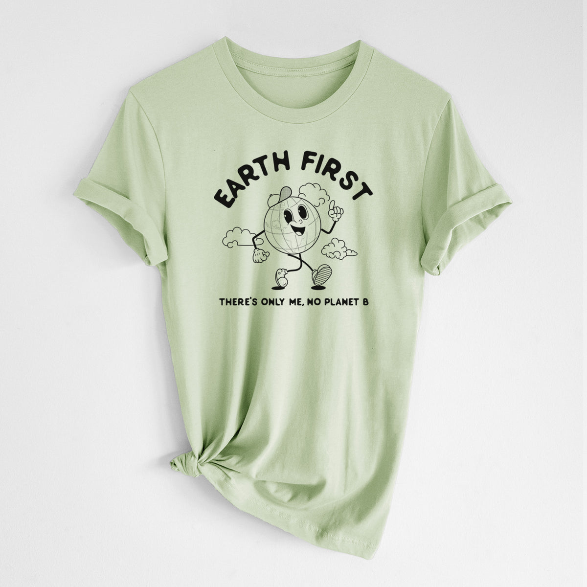 Spring green lightweight cotton t-shirt laid flat with the sleeves rolled, printed with a cheerful cartoon Earth running, with the words Earth First and There's Only Me, No Planet B.