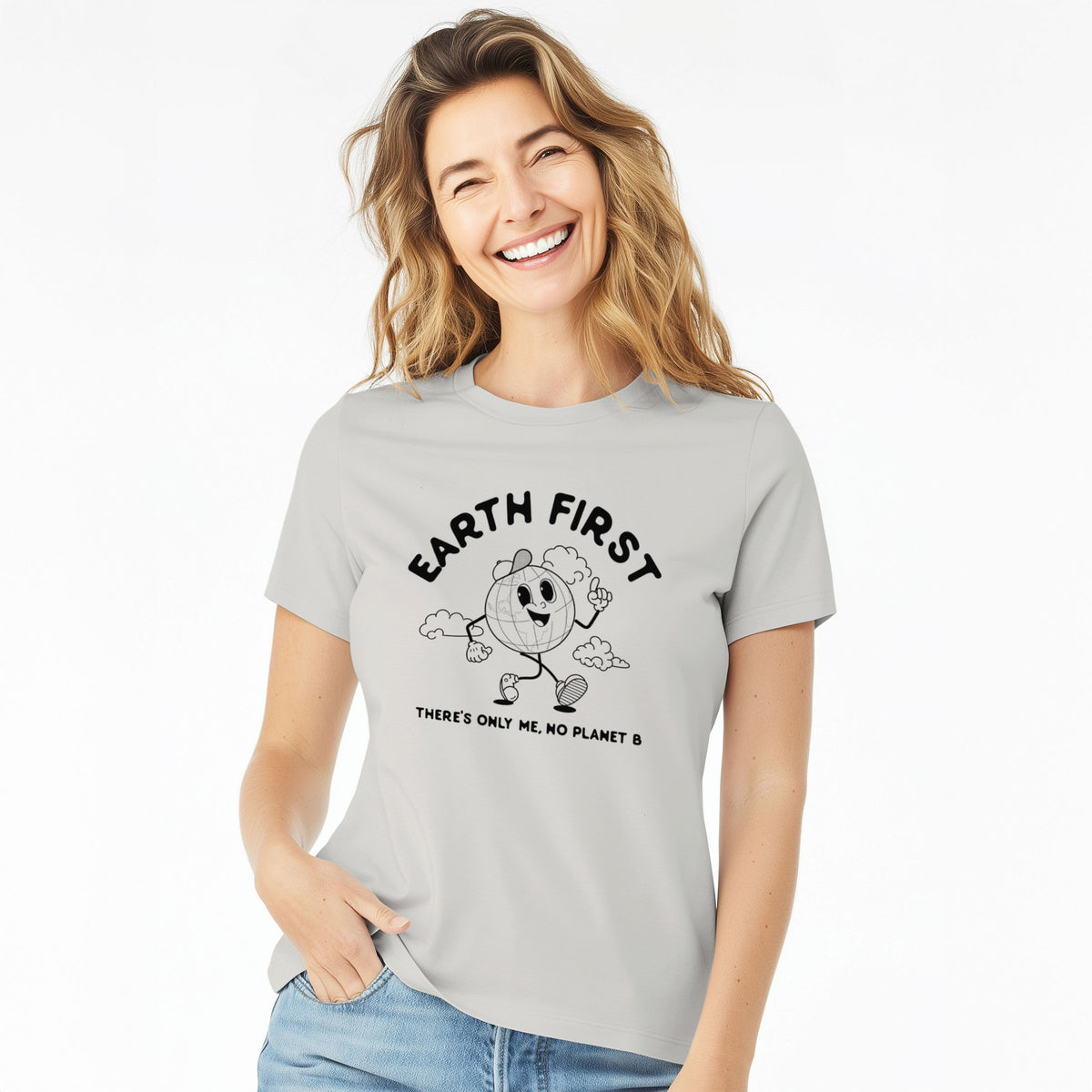 Woman wearing a lunar grey women's relaxed fit cotton t-shirt printed with a cheerful cartoon Earth running, with the words Earth First and There's Only Me, No Planet B.