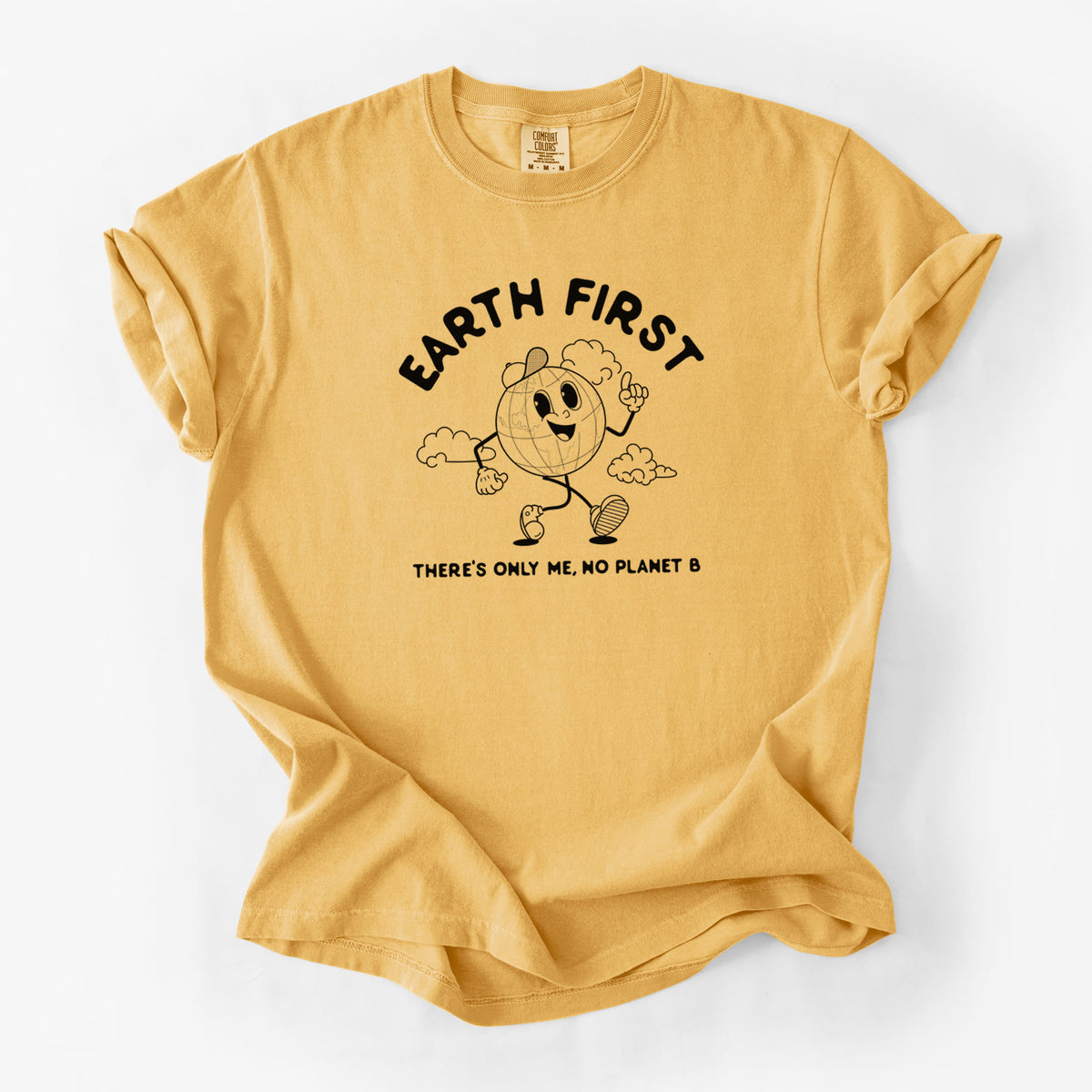 Golden wheat yellow Comfort Colors t-shirt laid flat, printed with a cheerful cartoon Earth running, with the words Earth First and There's Only Me, No Planet B.
