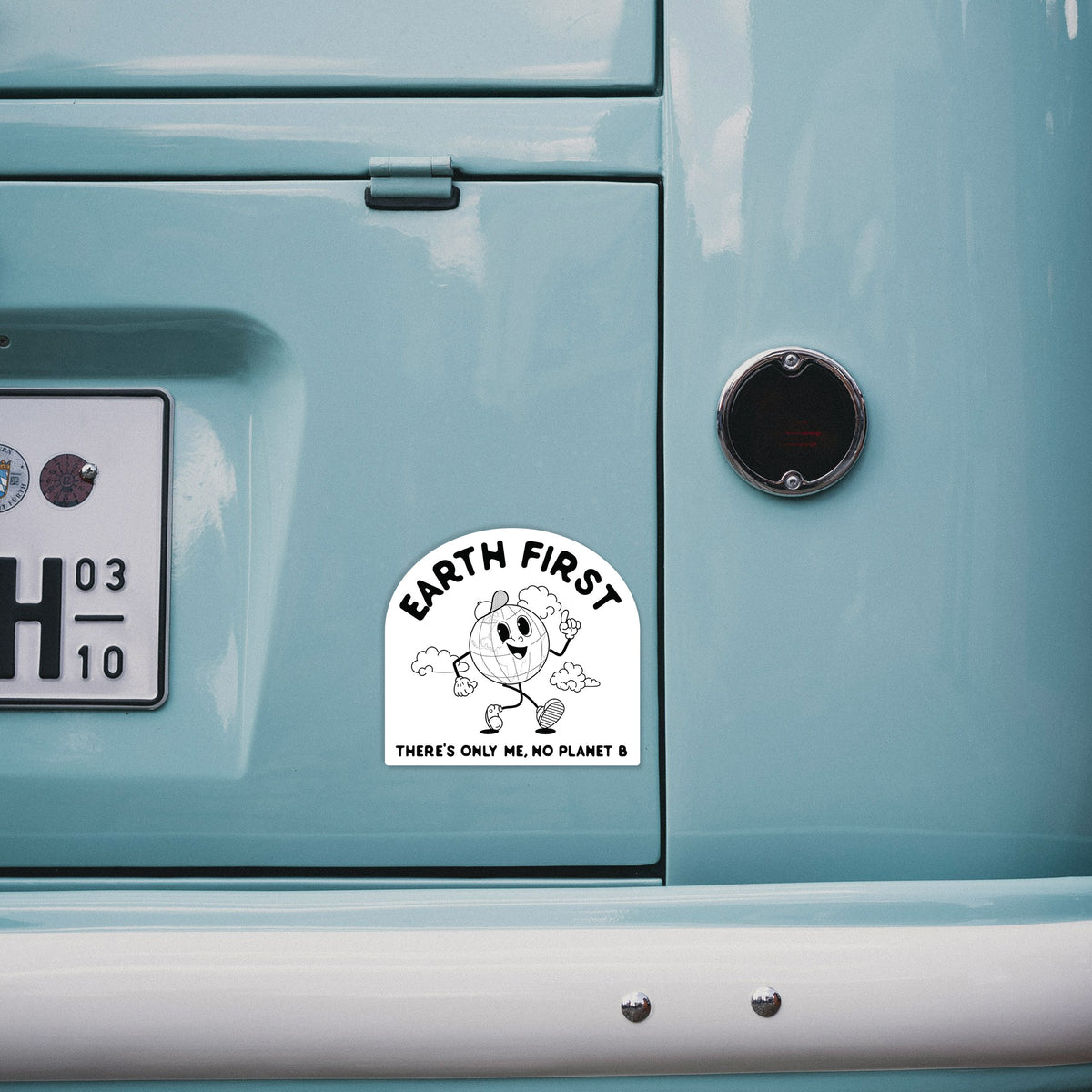 4 inch vinyl decal of a cheerful cartoon Earth running, with the words Earth First and There's Only Me, No Planet B on the back of a van.