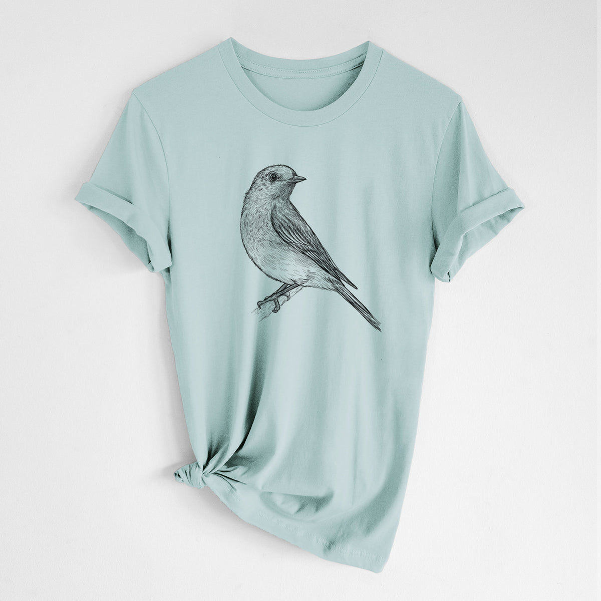 Dusty blue lightweight cotton t-shirt laid flat with the sleeves rolled, printed with a detailed black ink sketch of an eastern bluebird perched on a branch.