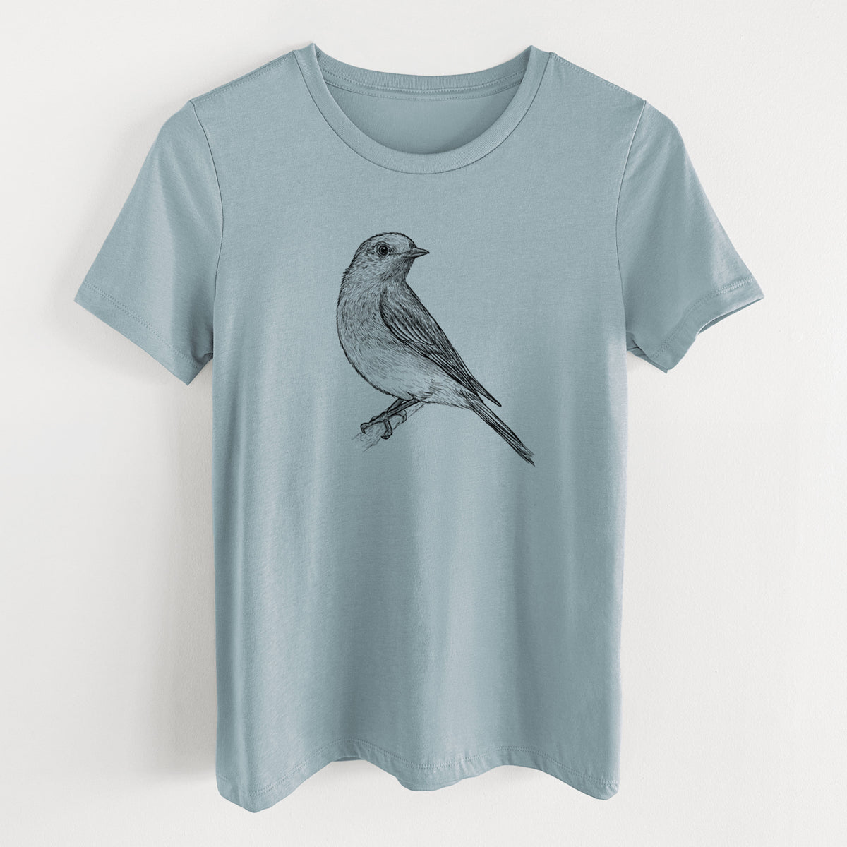 Vintage denim women's relaxed fit cotton t-shirt laid flat, printed with a detailed black ink sketch of an eastern bluebird perched on a branch.