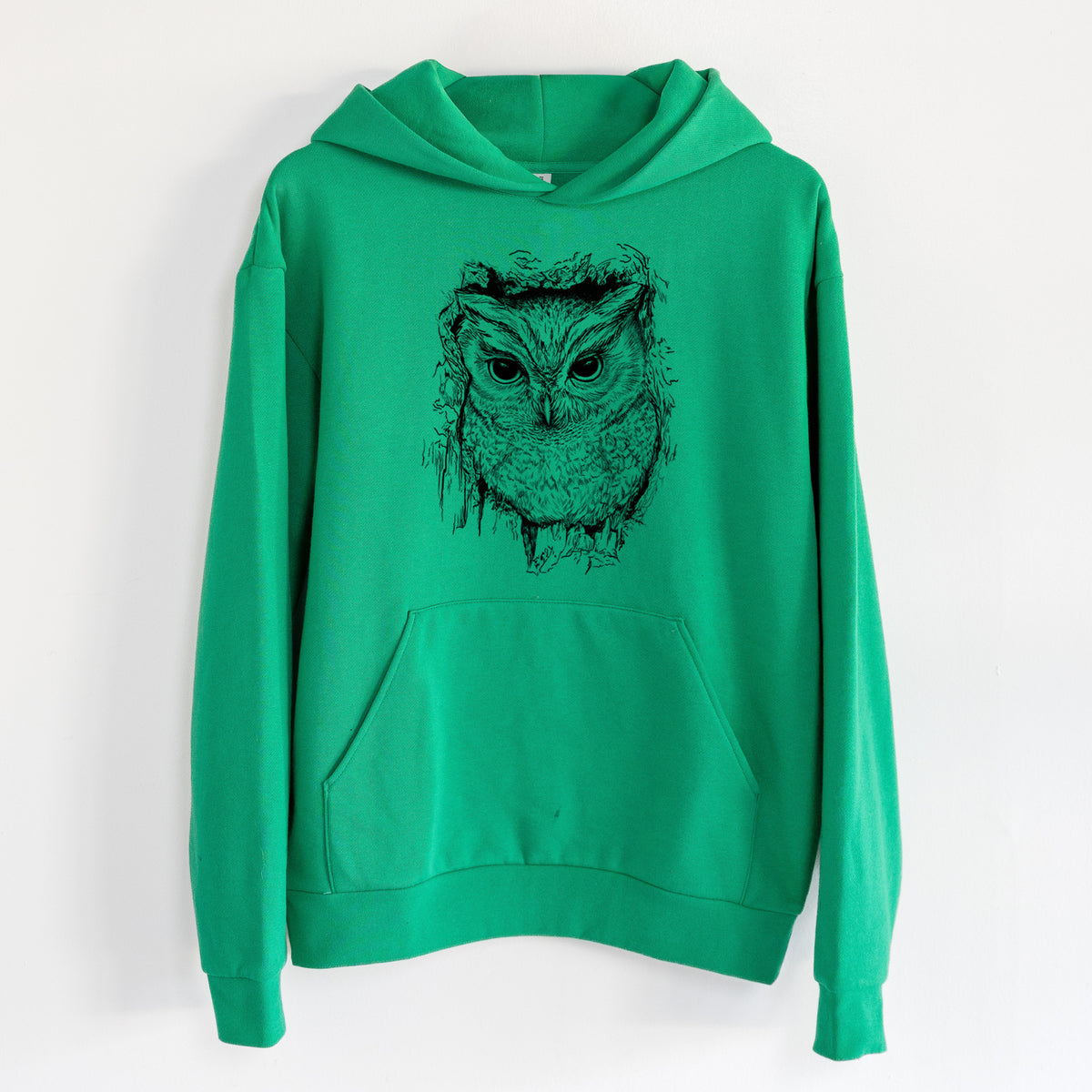 Eastern Screech Owl - Megascops asio - Statement Midweight Hoodie in Kelly Green, hanging on a white wall, with a front kangaroo pocket and no drawcords.