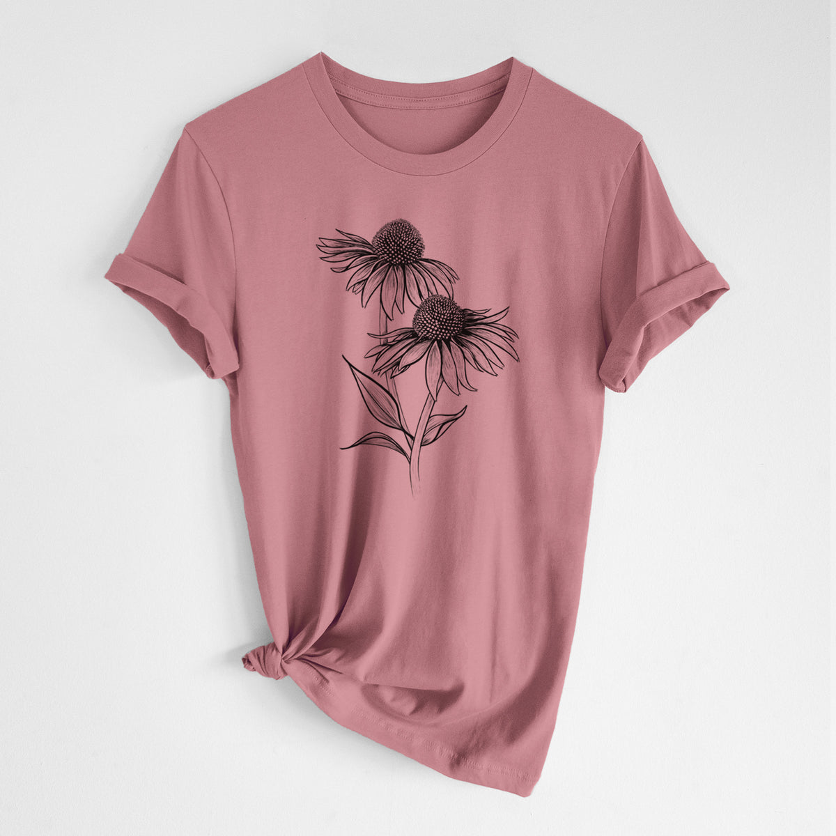 Mauve pink lightweight cotton t-shirt laid flat with the sleeves rolled, printed with a black ink line drawing of two coneflowers on tall stems.