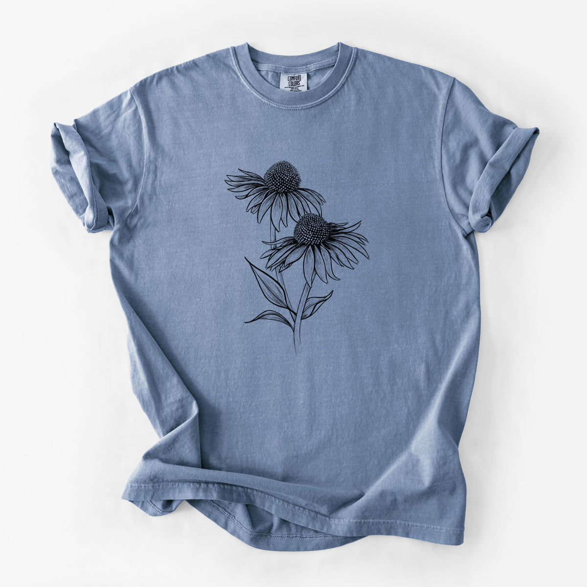 Blue jean Comfort Colors t-shirt laid flat, printed with a black ink line drawing of two coneflowers on tall stems.