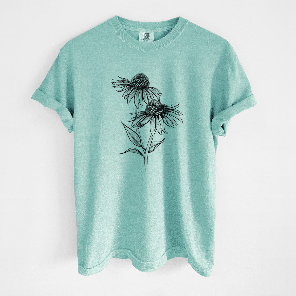 Chalky mint Comfort Colors t-shirt laid flat, printed with a black ink line drawing of two coneflowers on tall stems.