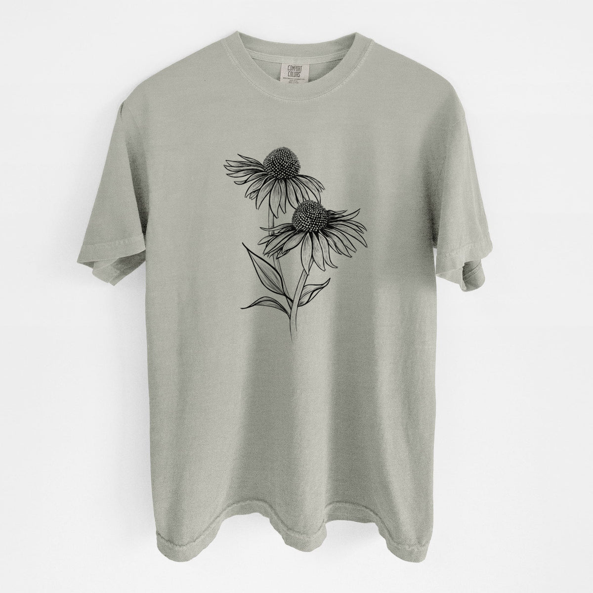 Sandstone beige Comfort Colors t-shirt laid flat, printed with a black ink line drawing of two coneflowers on tall stems.