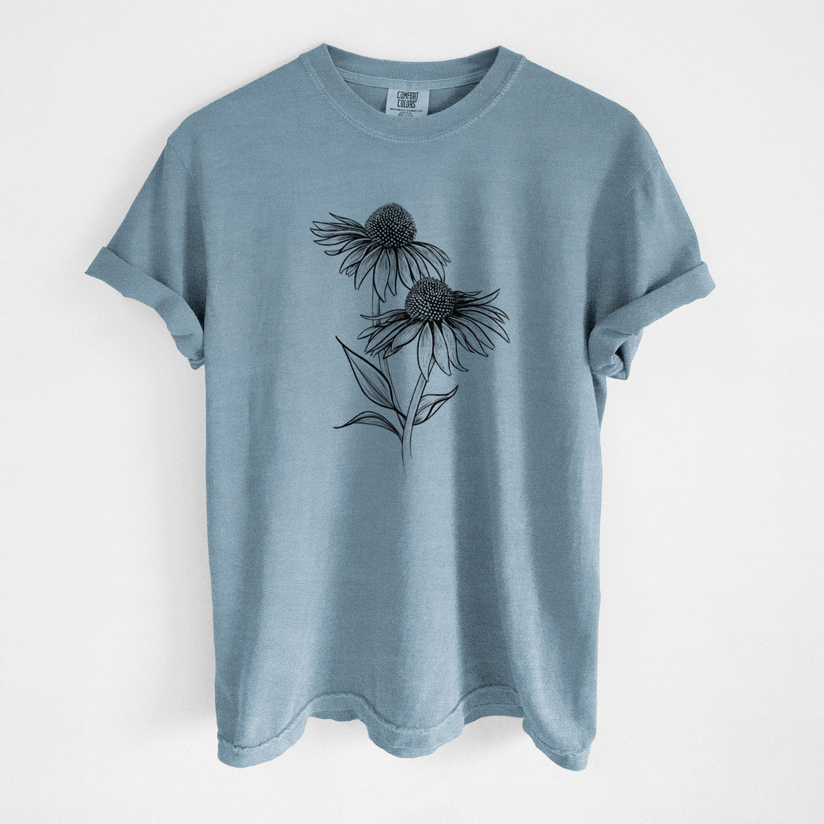Steel blue Comfort Colors t-shirt laid flat, printed with a black ink line drawing of two coneflowers on tall stems.
