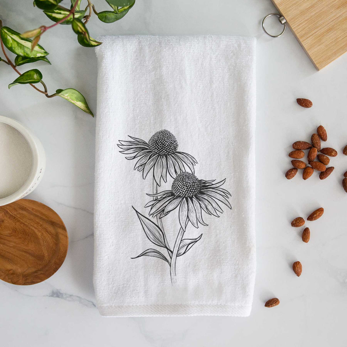 White hand towel printed with a black ink line drawing of two coneflowers on tall stems.
