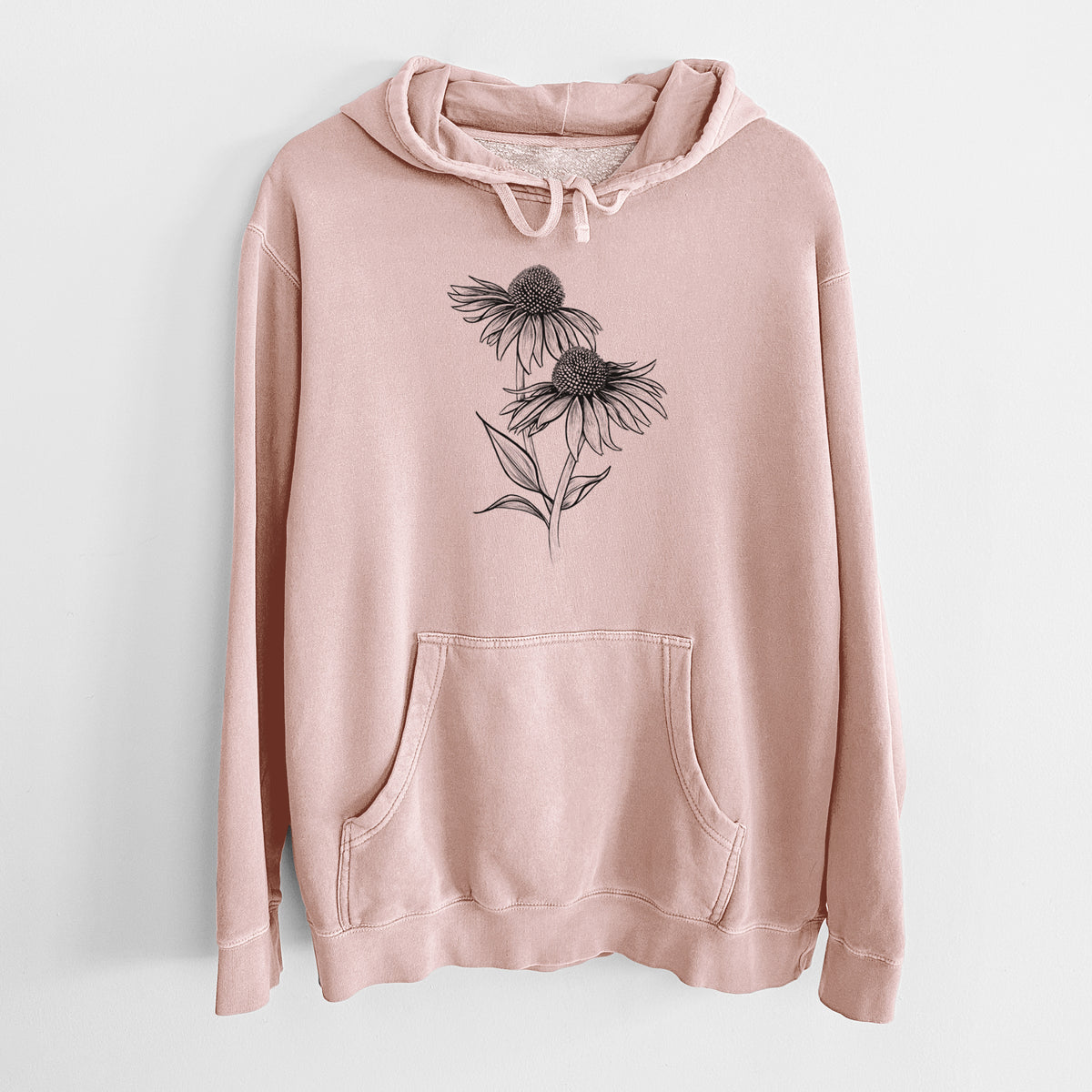 Dusty pink pigment dyed hoodie laid flat, printed with a black ink line drawing of two coneflowers on tall stems.