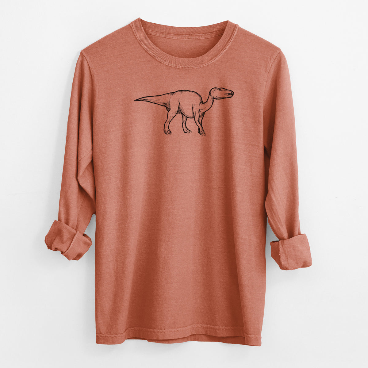 Yam burnt orange Comfort Colors long sleeve shirt laid flat with the cuffs rolled, printed with a black ink illustration of an Edmontosaurus walking.