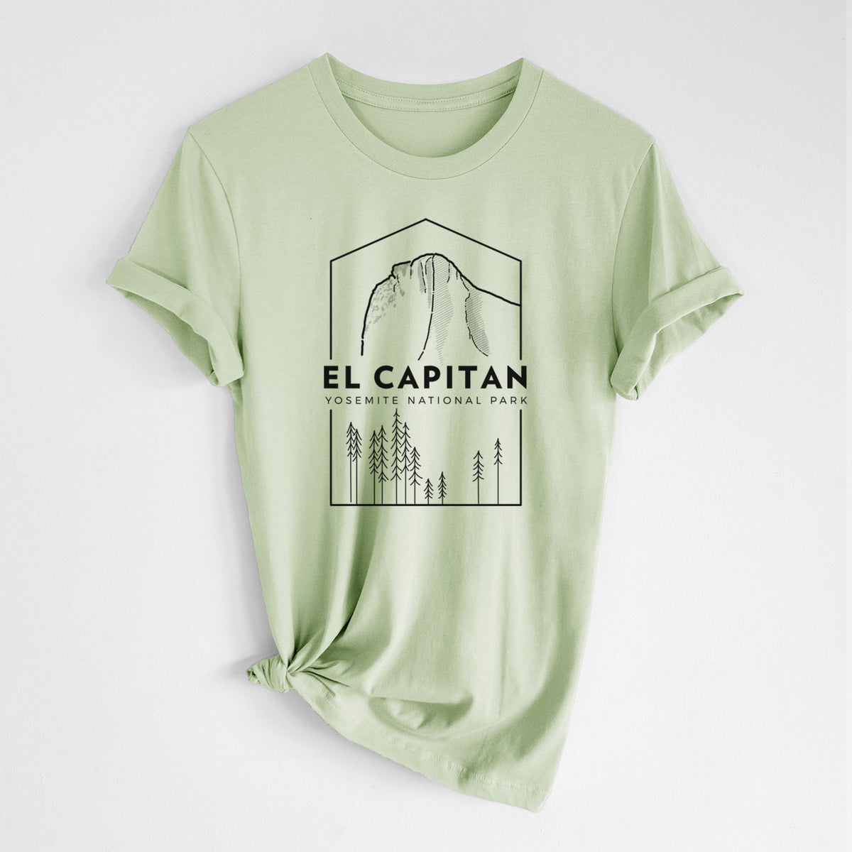 Spring green lightweight cotton t-shirt laid flat with the sleeves rolled, printed with a black line art badge of El Capitan rising above a pine forest, with the words El Capitan, Yosemite National Park.