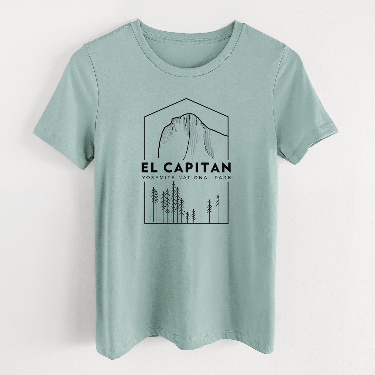 Dusty blue women's relaxed fit cotton t-shirt laid flat, printed with a black line art badge of El Capitan rising above a pine forest, with the words El Capitan, Yosemite National Park.