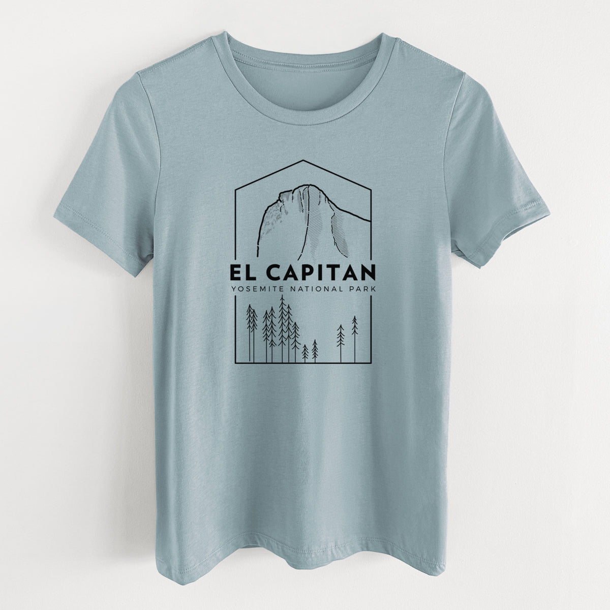 Vintage denim women's relaxed fit cotton t-shirt laid flat, printed with a black line art badge of El Capitan rising above a pine forest, with the words El Capitan, Yosemite National Park.