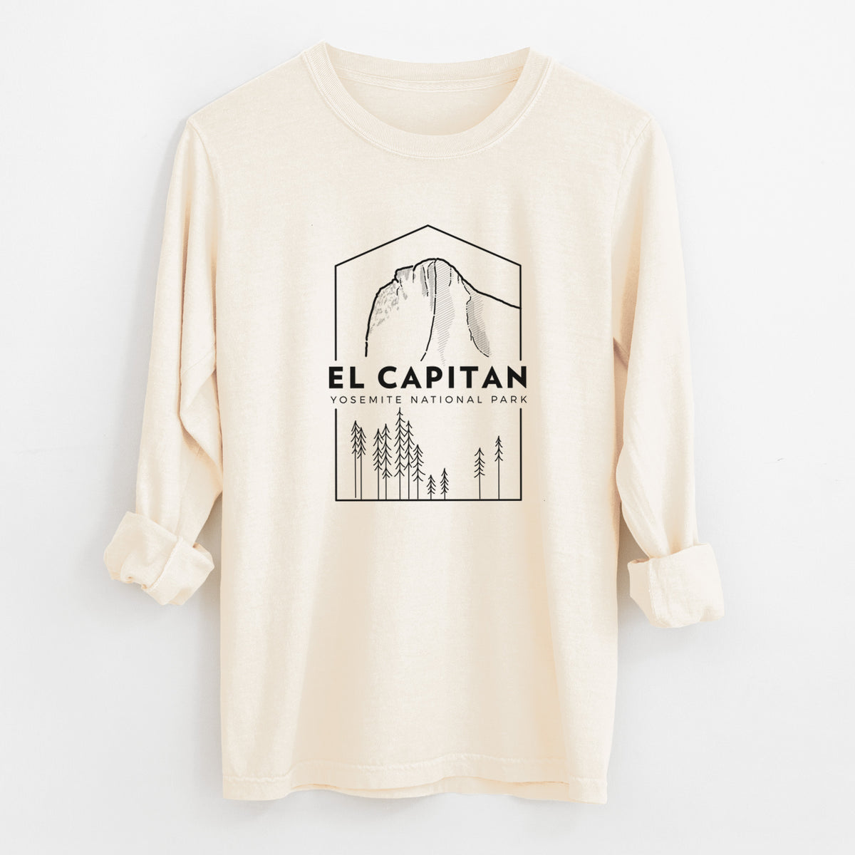Ivory Comfort Colors long sleeve shirt laid flat with the cuffs rolled, printed with a black line art badge of El Capitan rising above a pine forest, with the words El Capitan, Yosemite National Park.