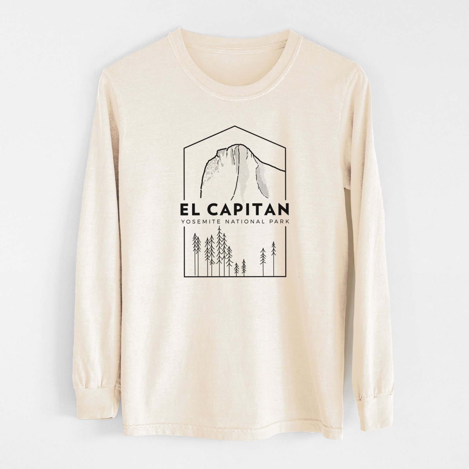 Ivory Comfort Colors long sleeve shirt laid flat, printed with a black line art badge of El Capitan rising above a pine forest, with the words El Capitan, Yosemite National Park.