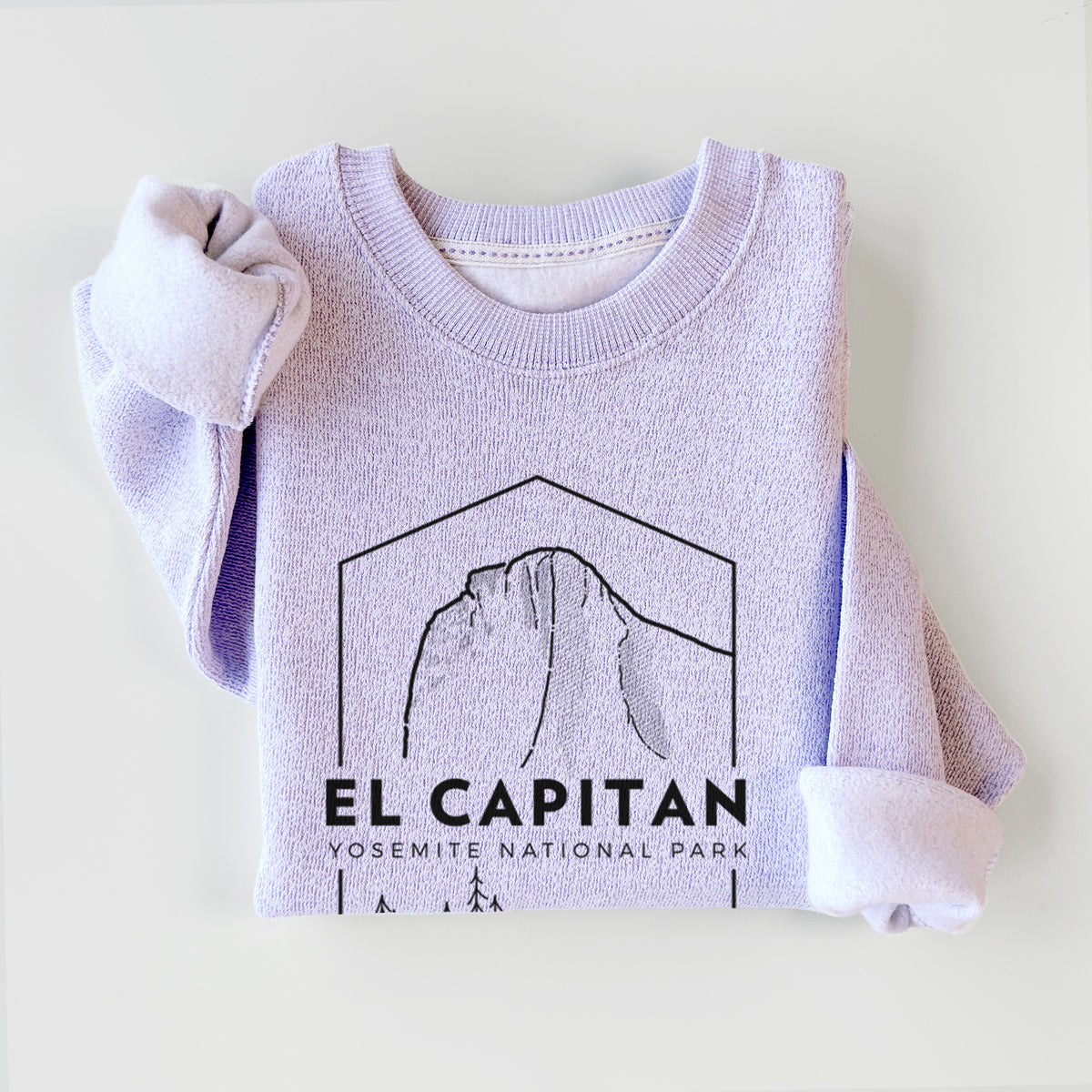 Ice purple knit sweatshirt printed with a black line art badge of El Capitan rising above a pine forest, with the words El Capitan, Yosemite National Park, styled flat.