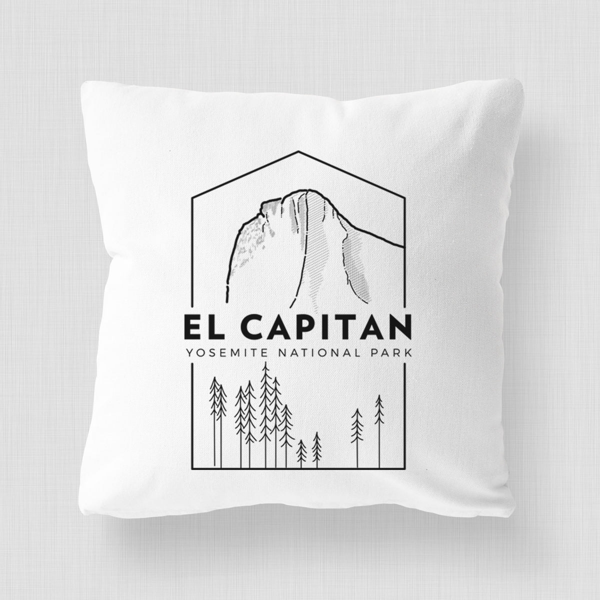 White pillow cover printed with a black line art badge of El Capitan rising above a pine forest, with the words El Capitan, Yosemite National Park.