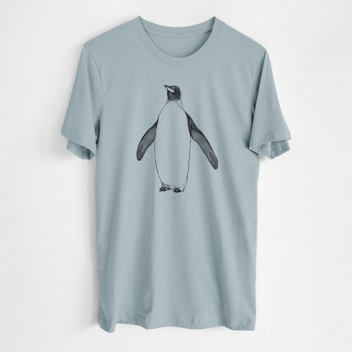 Vintage denim lightweight cotton t-shirt laid flat, printed with a black ink illustration of an emperor penguin standing.