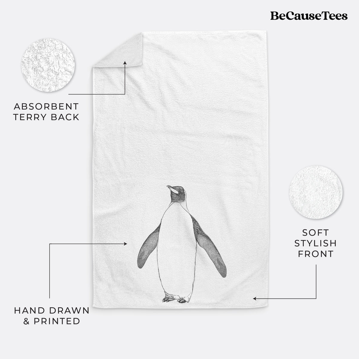 White hand towel printed with a black ink illustration of an emperor penguin standing.
