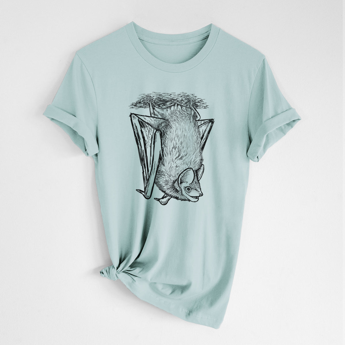 Dusty blue lightweight cotton t-shirt laid flat with the sleeves rolled, printed with a detailed black ink illustration of a big brown bat hanging upside down.