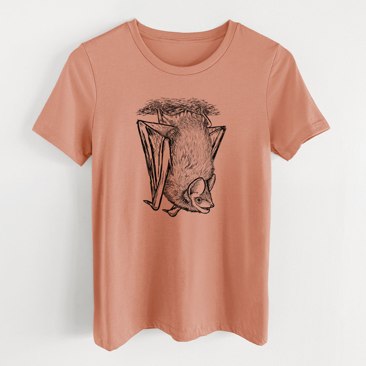 Terracotta orange women's relaxed fit cotton t-shirt laid flat, printed with a detailed black ink illustration of a big brown bat hanging upside down.