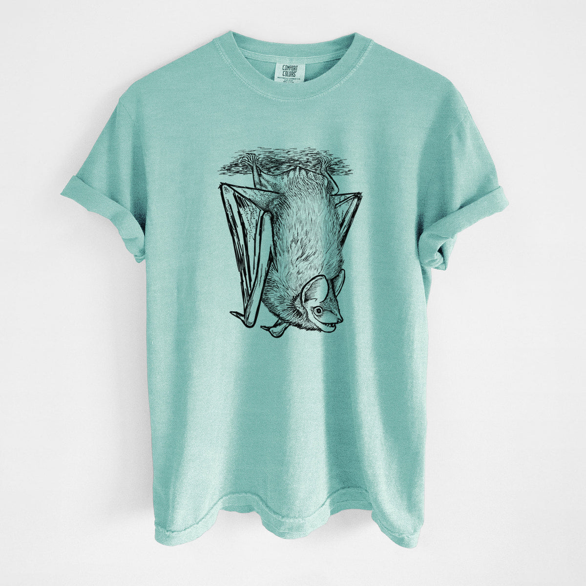 Chalky mint Comfort Colors t-shirt laid flat, printed with a detailed black ink illustration of a big brown bat hanging upside down.