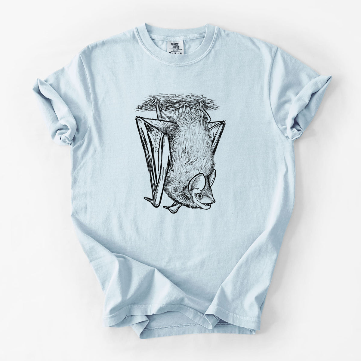 Chambray blue Comfort Colors t-shirt laid flat, printed with a detailed black ink illustration of a big brown bat hanging upside down.