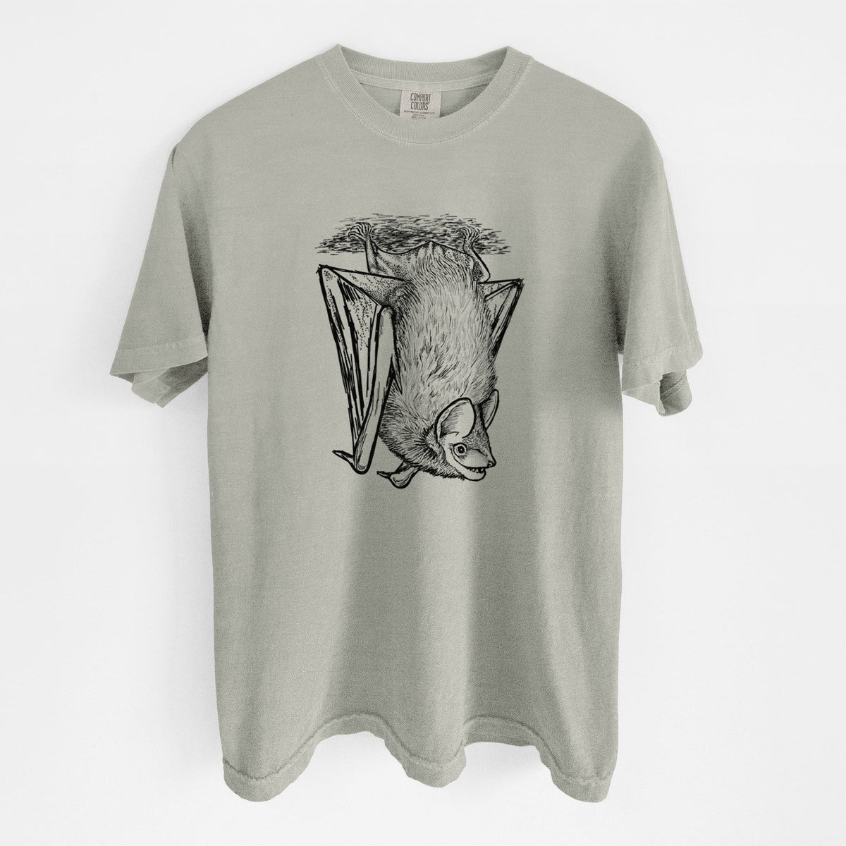 Sandstone beige Comfort Colors t-shirt laid flat, printed with a detailed black ink illustration of a big brown bat hanging upside down.
