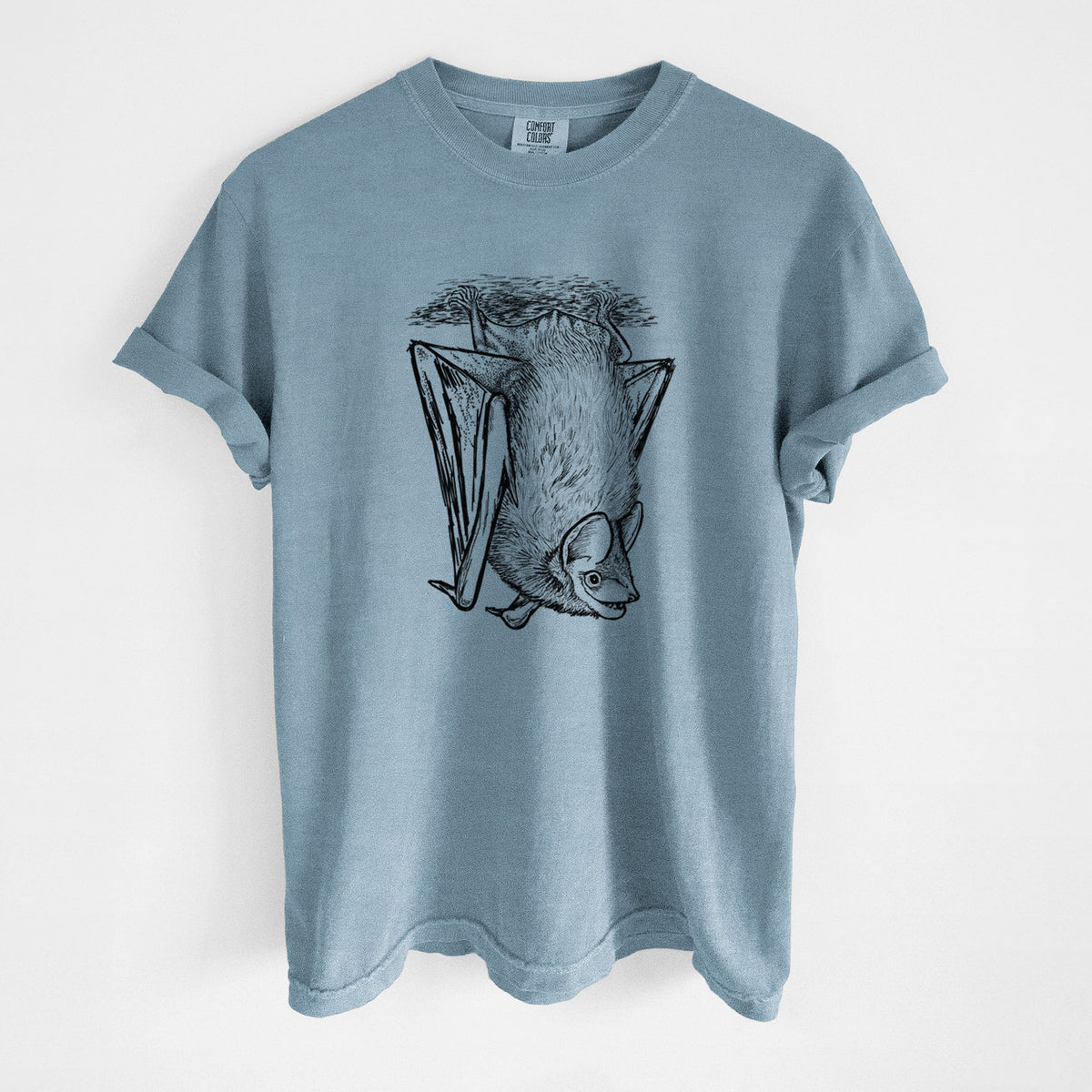 Steel blue Comfort Colors t-shirt laid flat, printed with a detailed black ink illustration of a big brown bat hanging upside down.