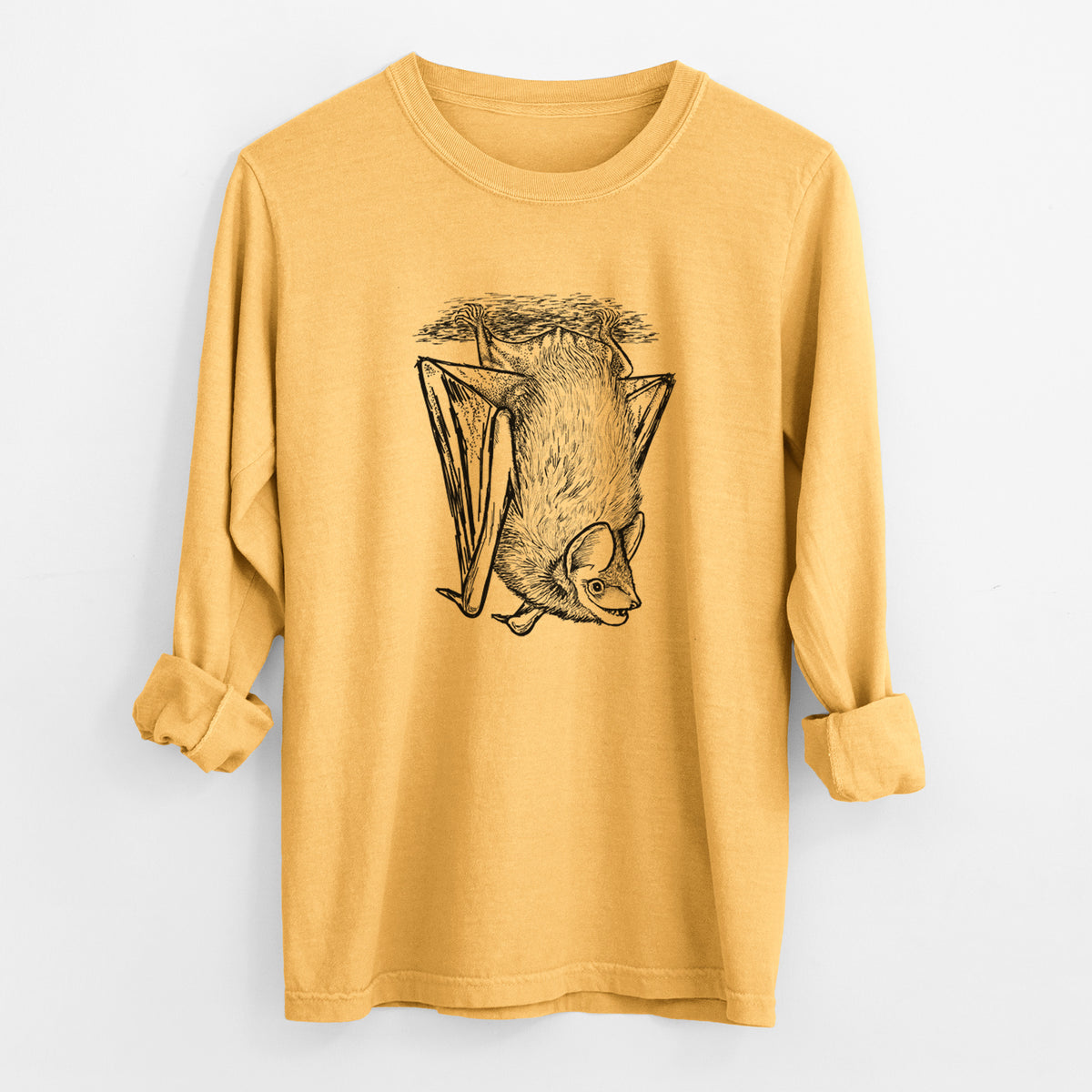 Golden wheat yellow Comfort Colors long sleeve shirt laid flat with the cuffs rolled, printed with a detailed black ink illustration of a big brown bat hanging upside down.