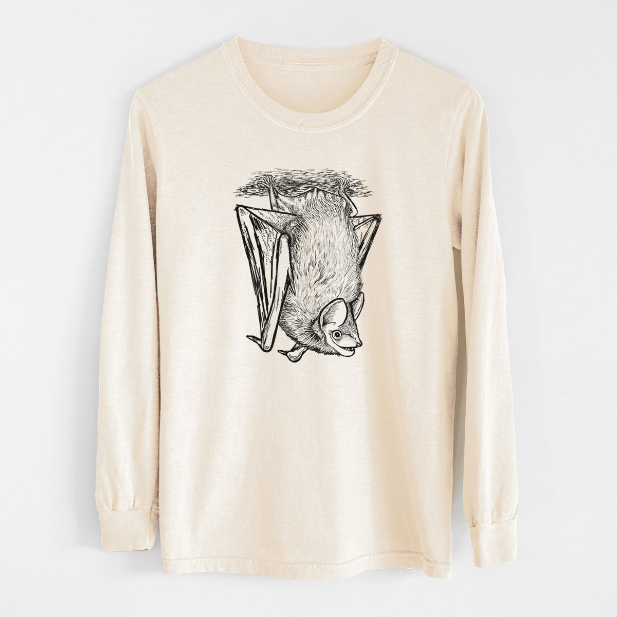 Ivory Comfort Colors long sleeve shirt laid flat, printed with a detailed black ink illustration of a big brown bat hanging upside down.