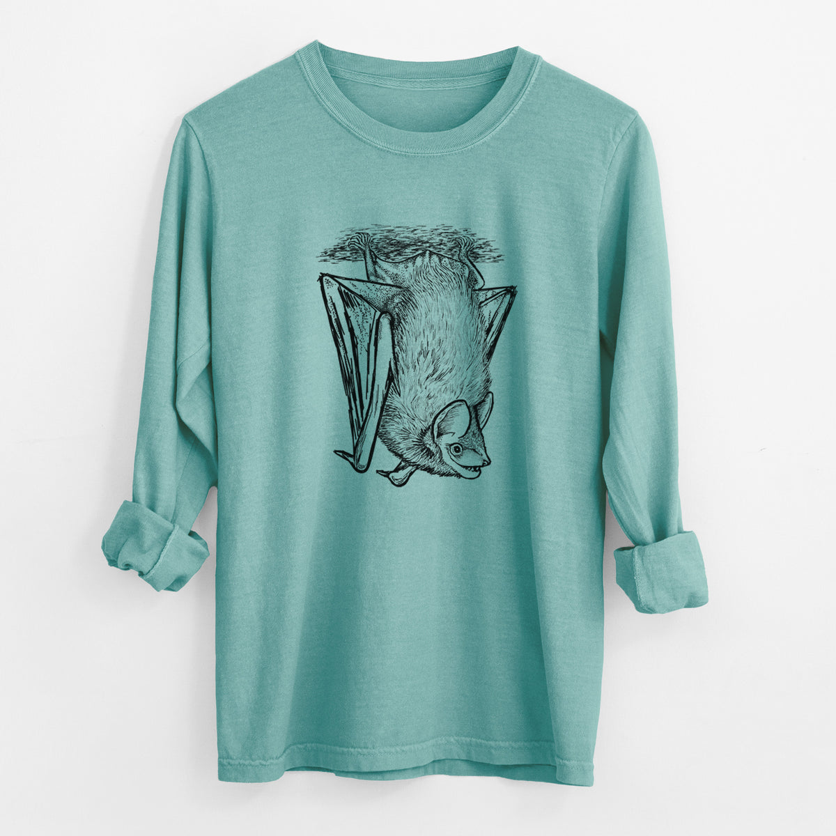 Reef green Comfort Colors long sleeve shirt laid flat with the cuffs rolled, printed with a detailed black ink illustration of a big brown bat hanging upside down.