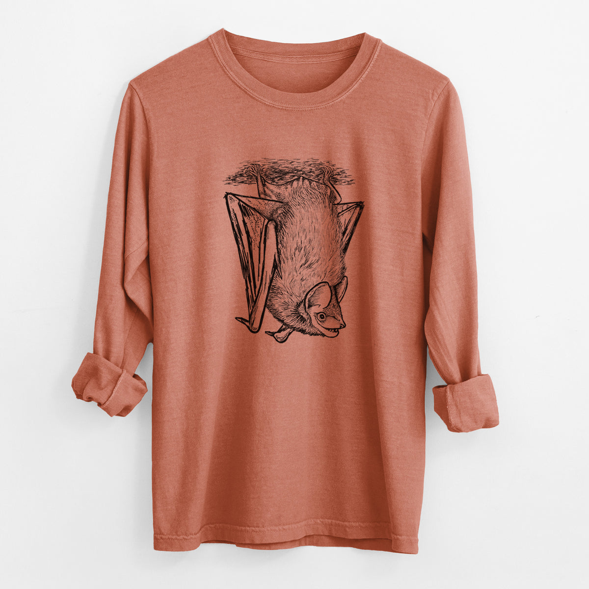 Yam burnt orange Comfort Colors long sleeve shirt laid flat with the cuffs rolled, printed with a detailed black ink illustration of a big brown bat hanging upside down.
