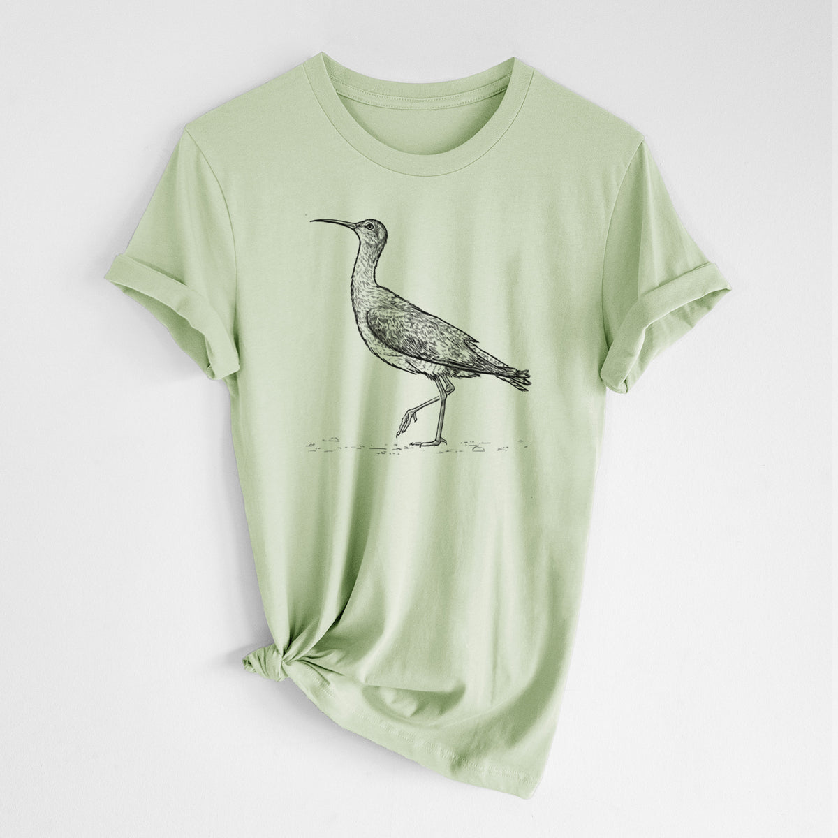 Spring green lightweight cotton t-shirt laid flat with the sleeves rolled, printed with a detailed black ink illustration of an Eskimo curlew with its long curved bill, walking.