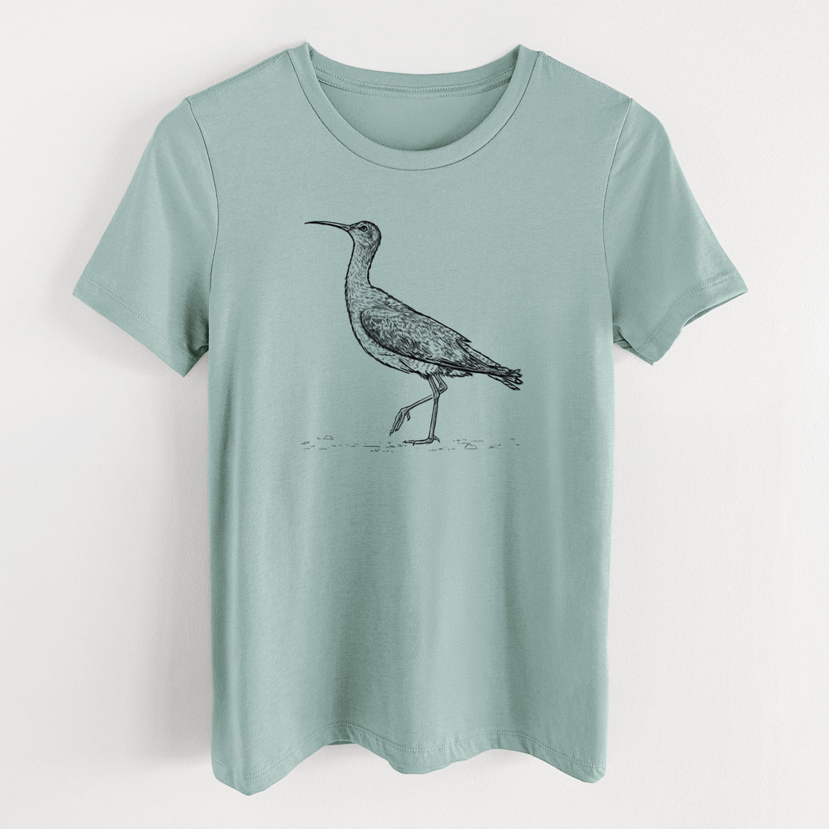 Dusty blue women's relaxed fit cotton t-shirt laid flat, printed with a detailed black ink illustration of an Eskimo curlew with its long curved bill, walking.