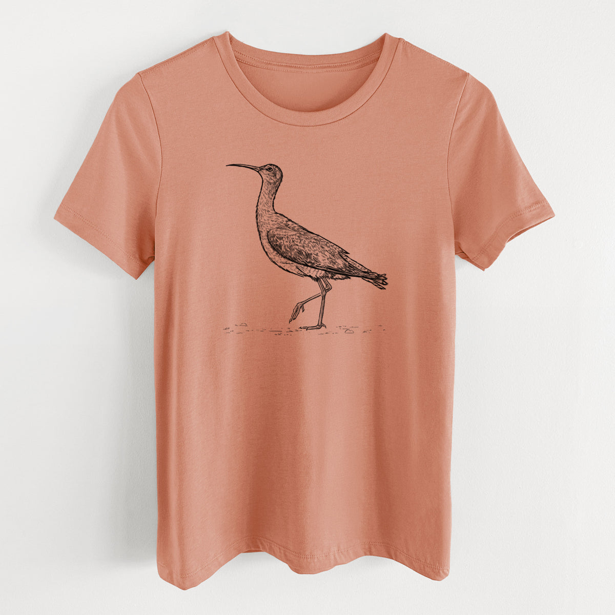 Terracotta orange women's relaxed fit cotton t-shirt laid flat, printed with a detailed black ink illustration of an Eskimo curlew with its long curved bill, walking.