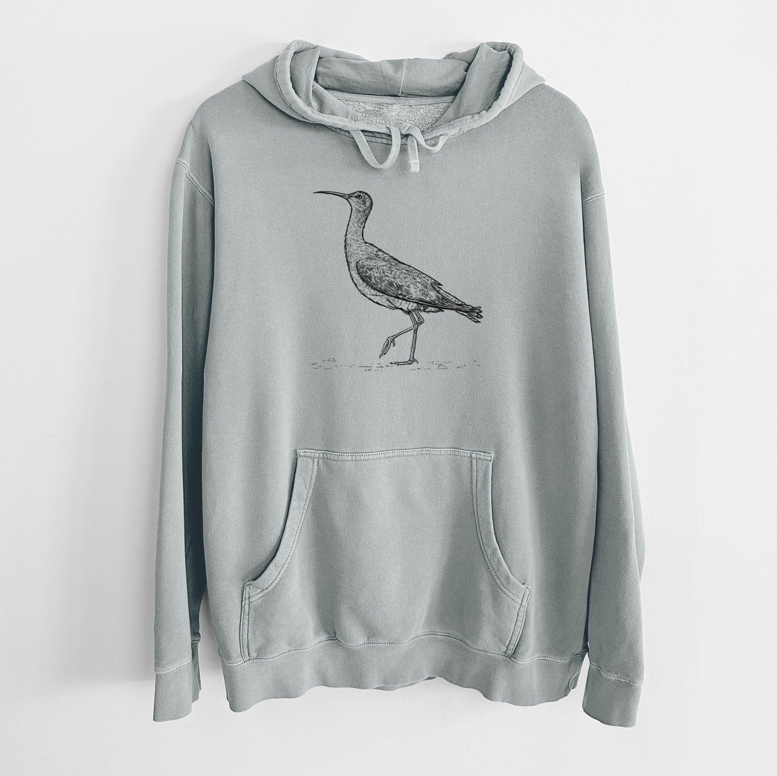 Sage green pigment dyed hoodie laid flat, printed with a detailed black ink illustration of an Eskimo curlew with its long curved bill, walking.