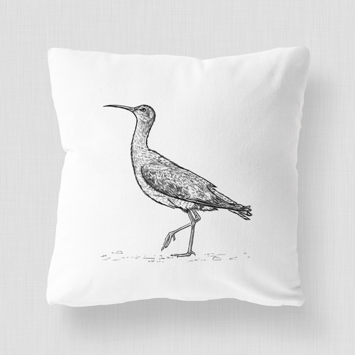 White pillow cover printed with a detailed black ink illustration of an Eskimo curlew with its long curved bill, walking.