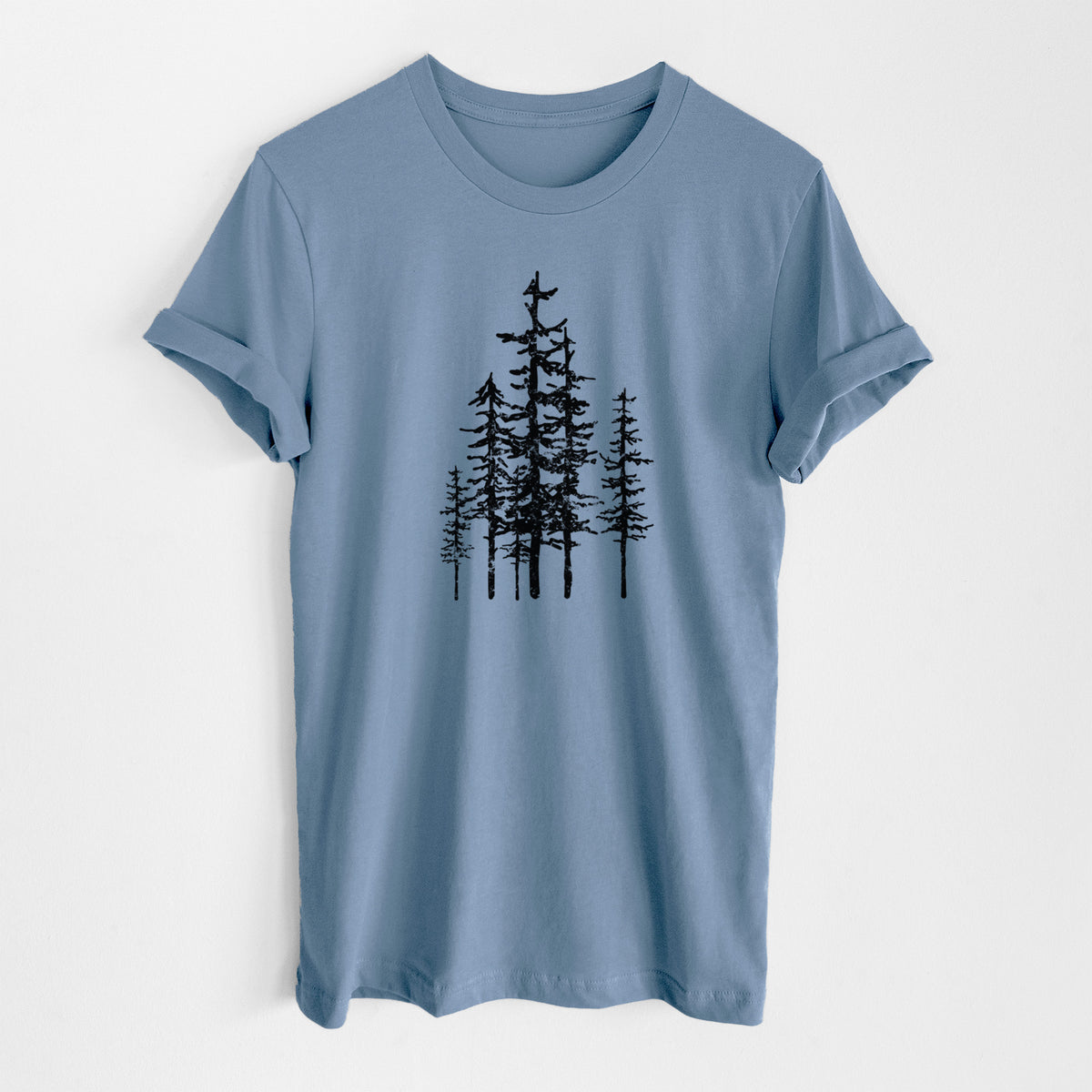 Steel blue lightweight cotton t-shirt laid flat, printed with a black ink illustration of a cluster of evergreen trees of varying heights.